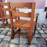 Pair of vintage oak armchairs with geometric design.