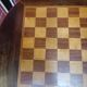 Pedestal table chessboard inlaid old pegs and staples
