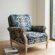 Pair of Armchairs, Louis XVI style, low model, white lacquered, blue fabric with royal decoration.