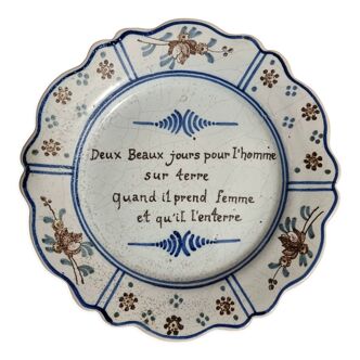Old plate in faience of Nevers with humorous phrase