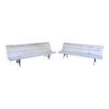 Pair of antique wooden slatted benches with wrought iron legs.