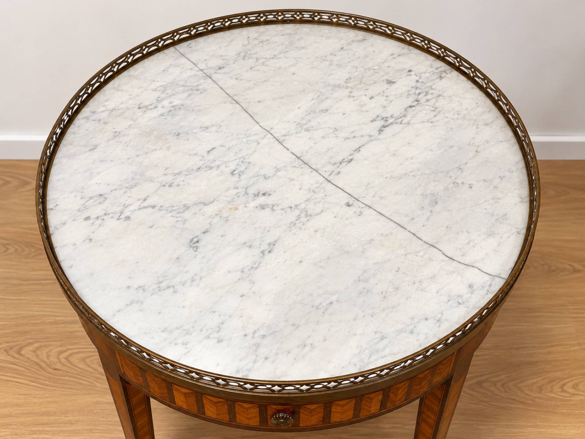 Bouillotte table in Louis XVI style with marquetry, marble, and brass.