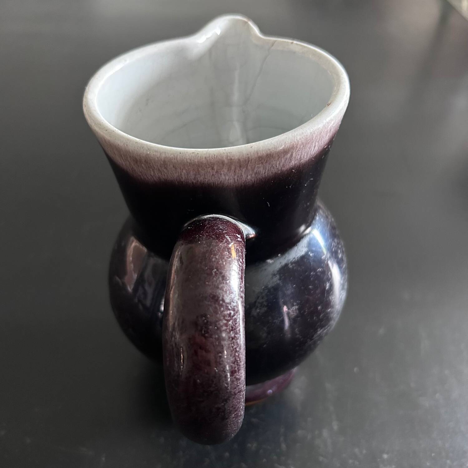 Antique tilted pitcher