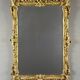 Large gilded wooden mirror in Louis XV style, 19th century.