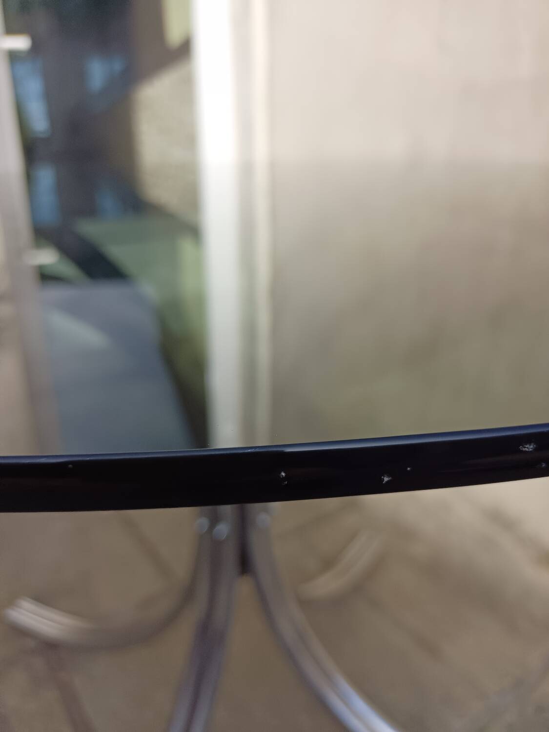 Chromed metal and smoked glass table
