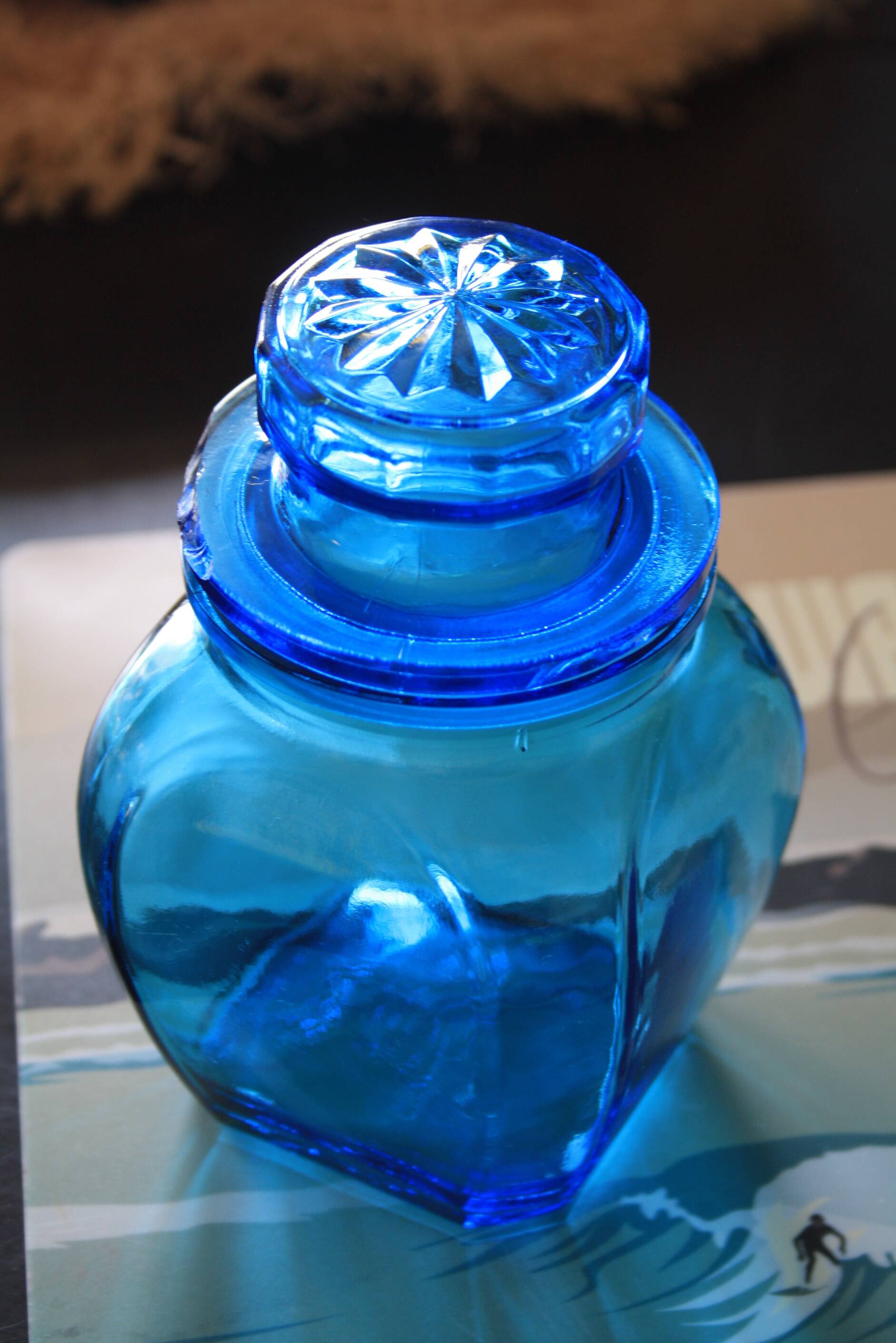 Blue glass jar with airtight lid