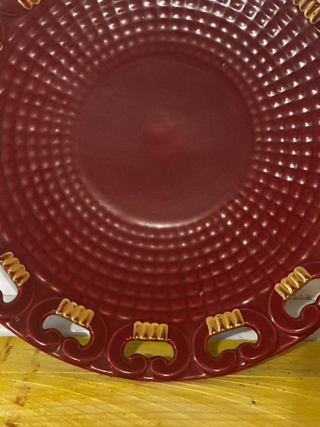 Burgundy and gold openwork plate in ceramic from Saint-Clement, 1950s.