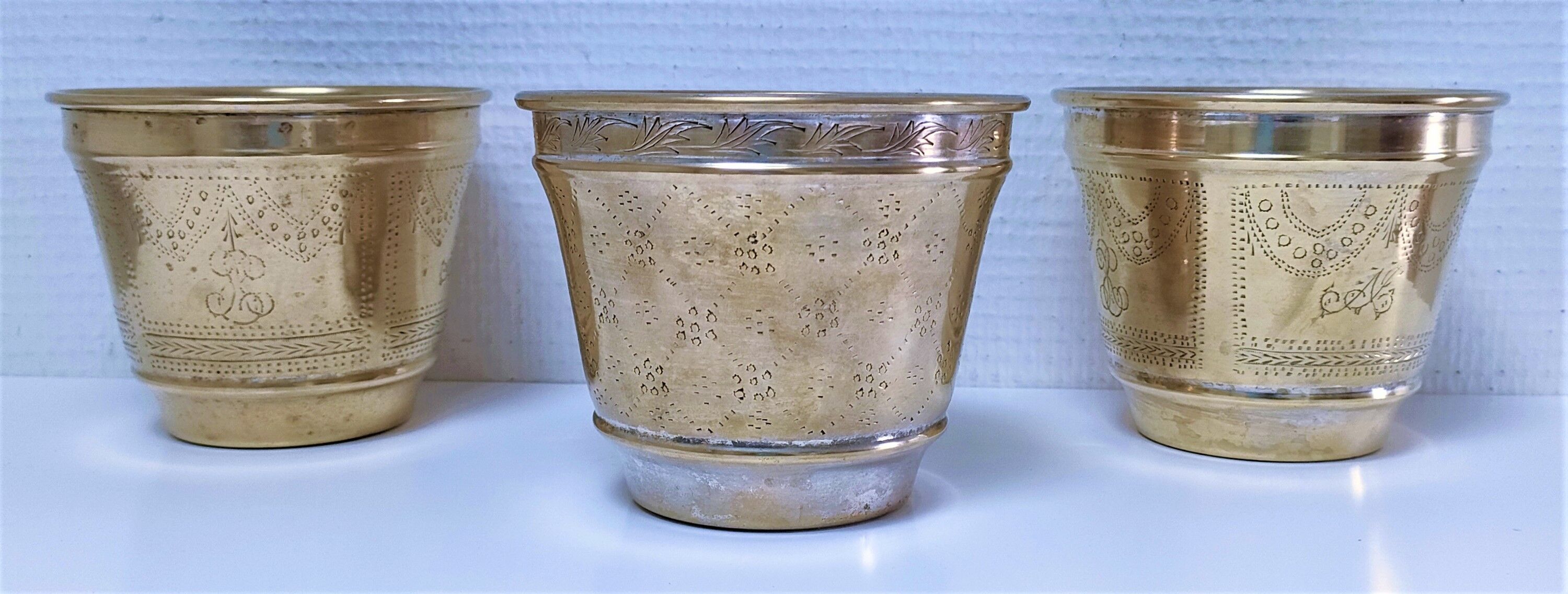 Three pot covers brass silver cover golden patina monogram early twentieth century