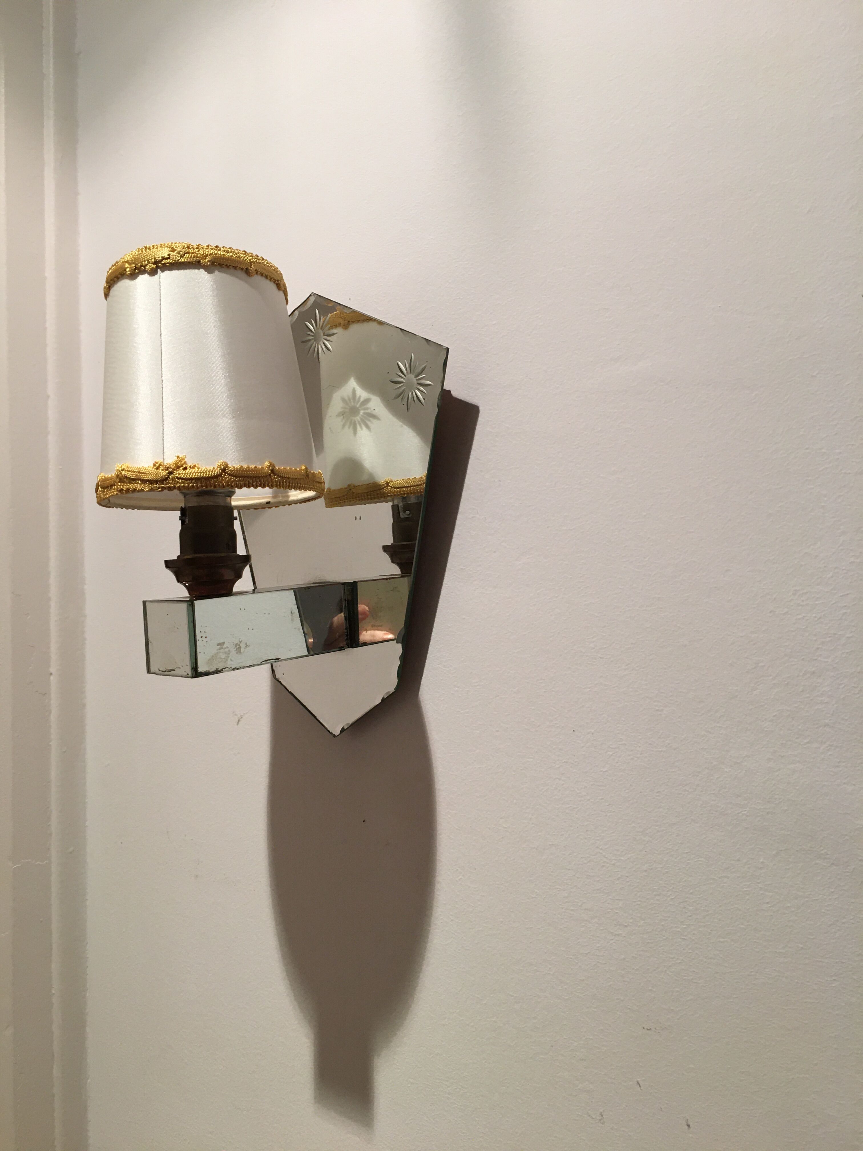 Pair of art deco sconces in venetian style mirror