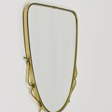 Elegant wall mirror in brass and black from the mid-century, Italy, 1950s.