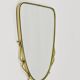 Elegant wall mirror in brass and black from the mid-century, Italy, 1950s.
