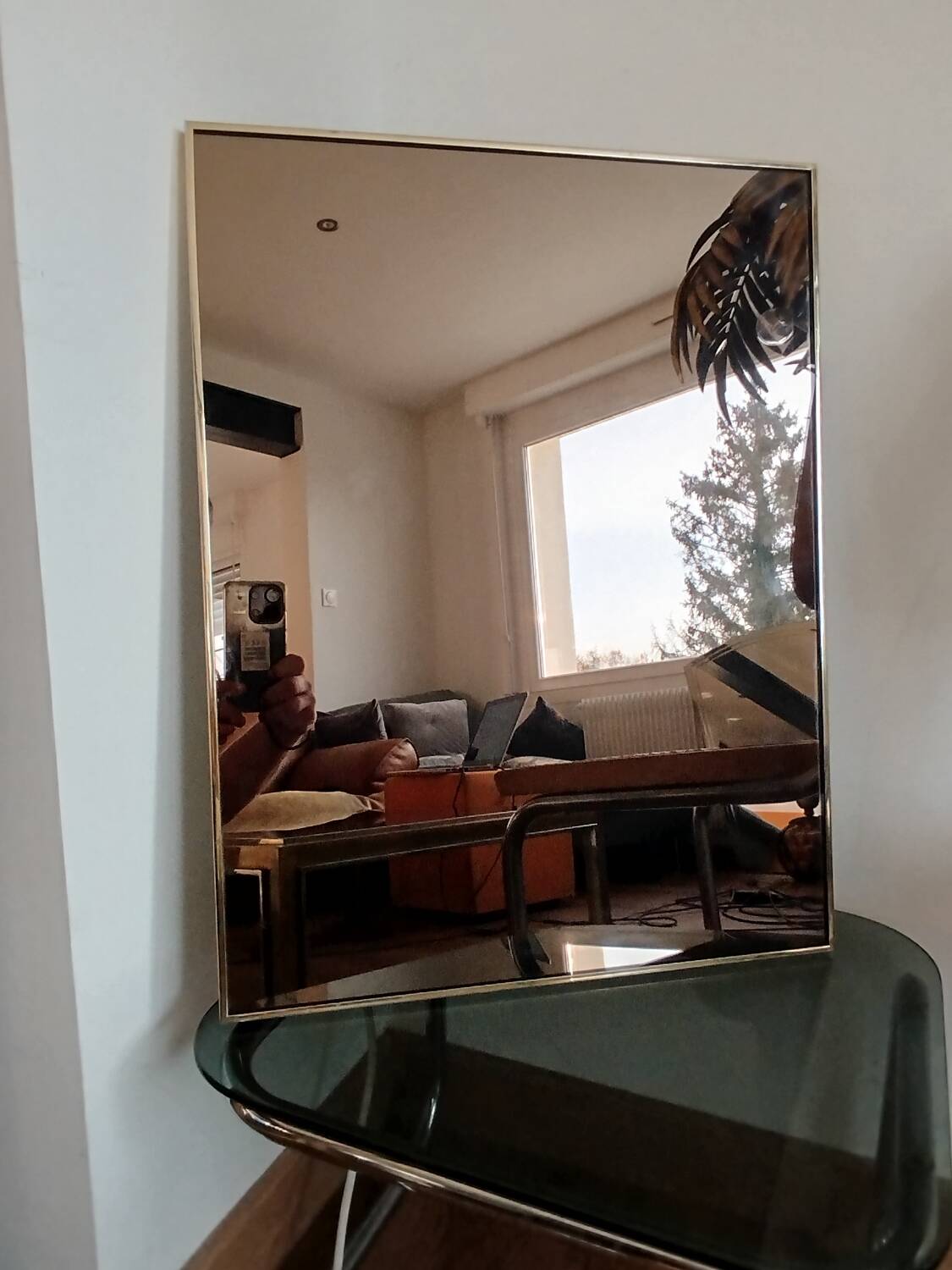 Vintage mirror in gilded brass and smoked glass. circa 1970