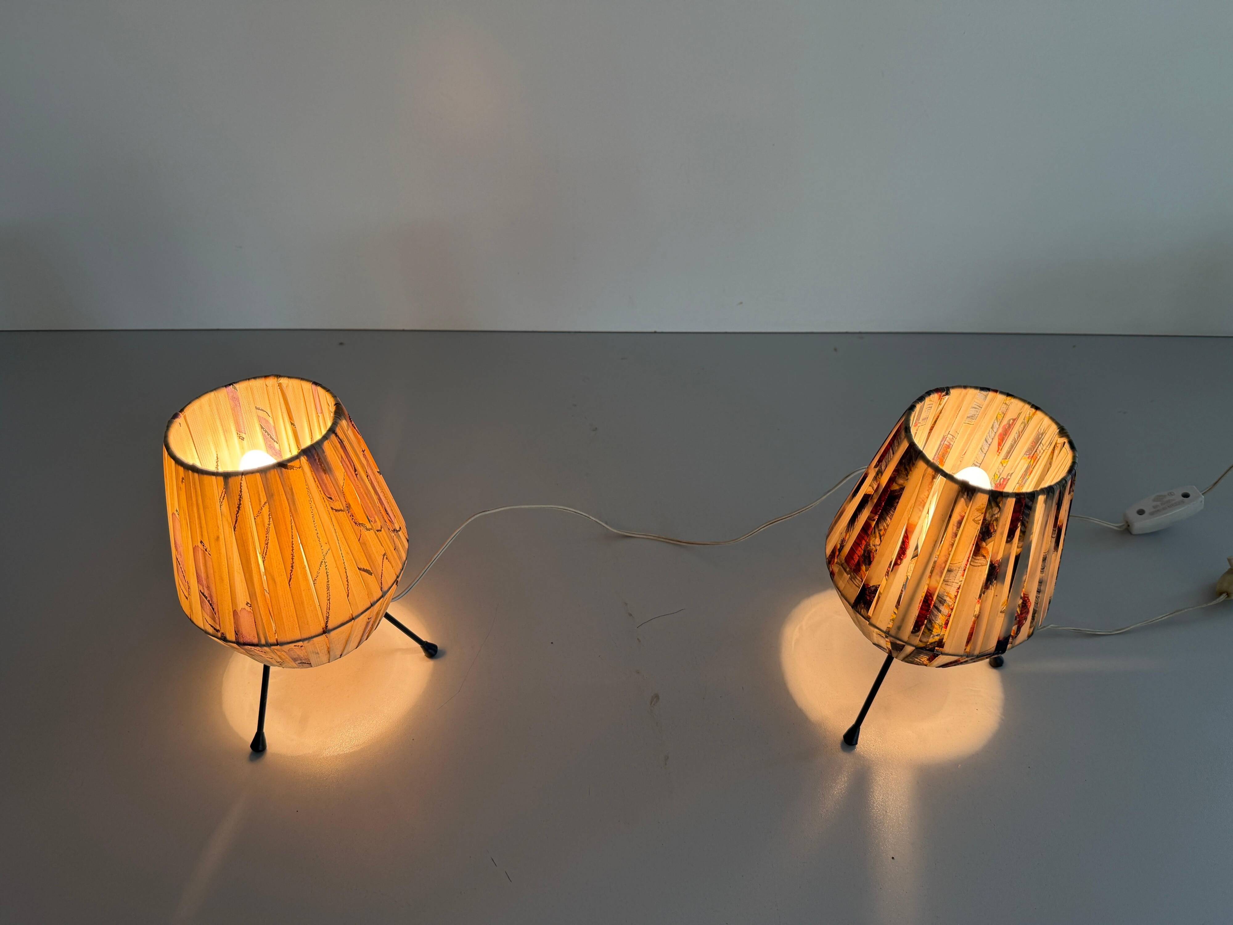 Pair of table lamps with plastic shades and tripod base, 1960s, Italy