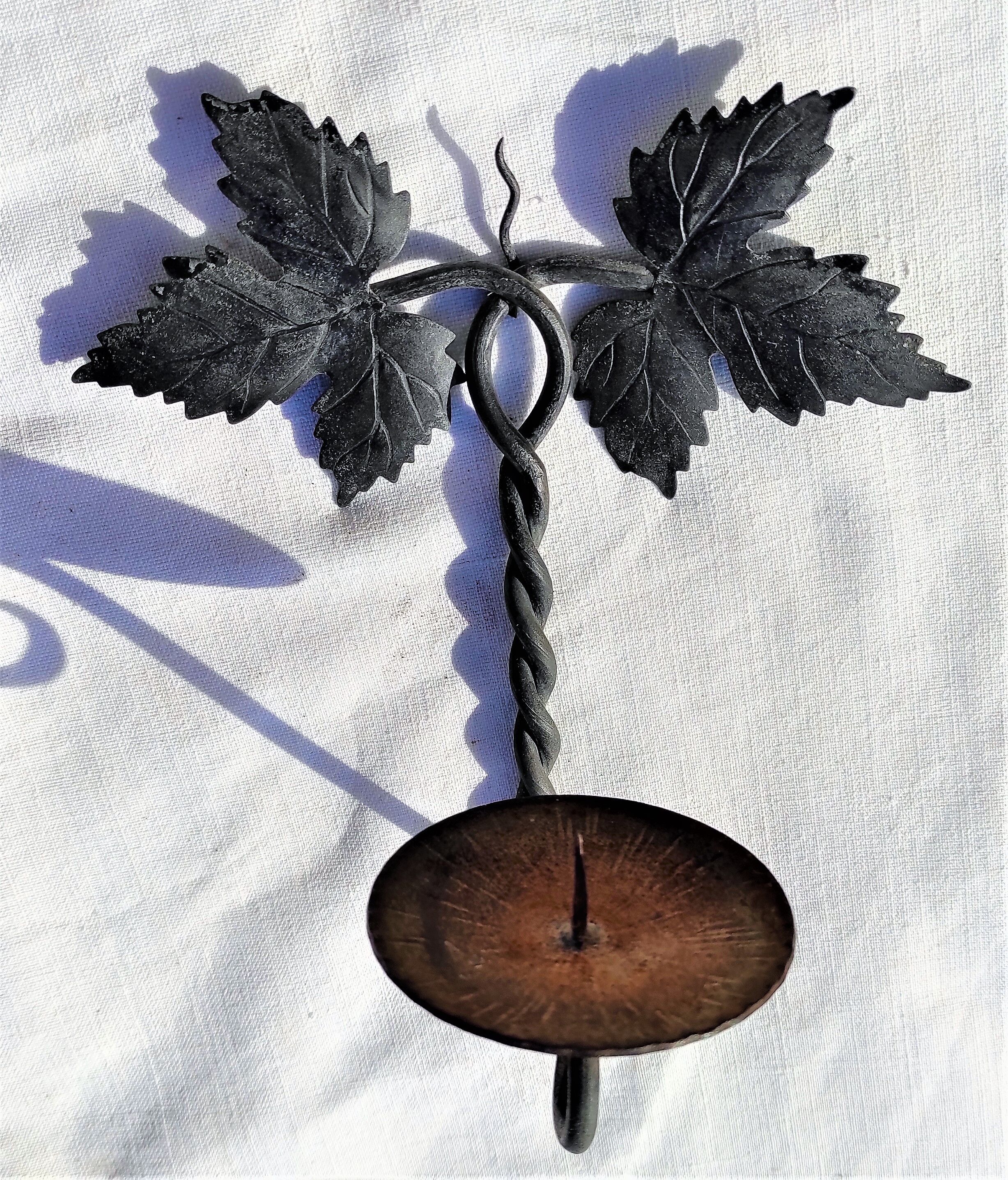 Wrought iron wall candle lamp with ancient vine leaves