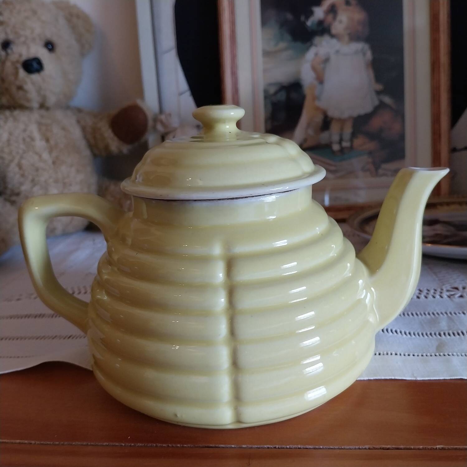 Old yellow earthenware teapot