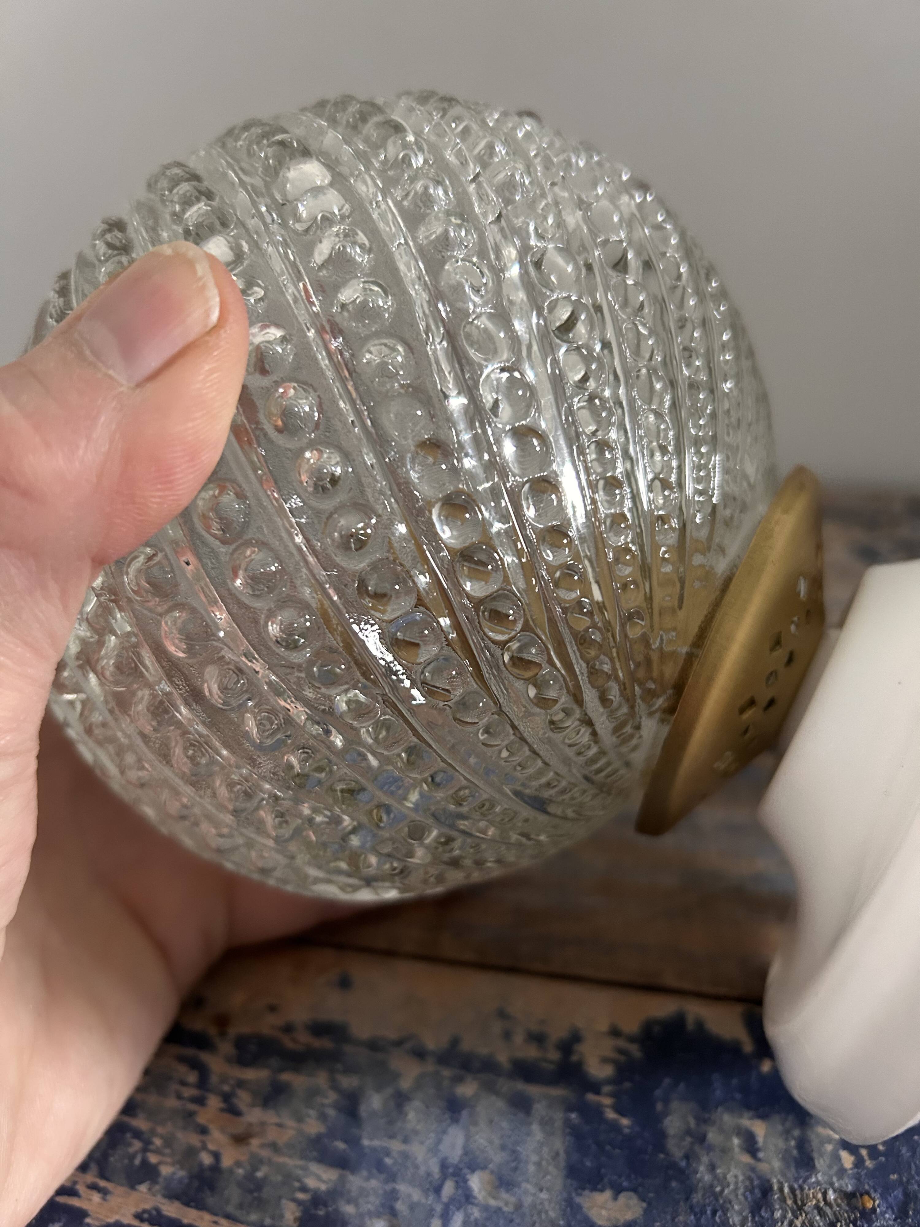 Set of two chiseled glass globe wall lights