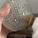 Set of two chiseled glass globe wall lights