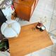 Old wooden desk or side table with compass legs