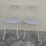 Pair of wrought iron garden chairs, antique manufacture