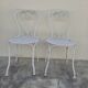 Pair of wrought iron garden chairs, antique manufacture