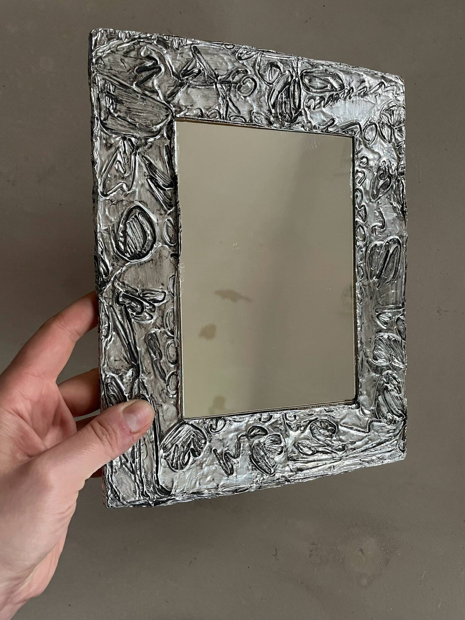 Vintage stamped mirror
