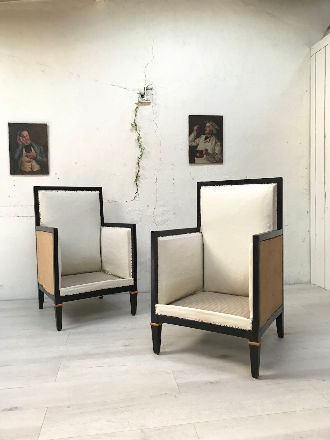Pair of blackened wooden armchairs