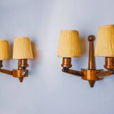Pair of two-armed art deco "ball" wall lights, carved wood, France, 1960