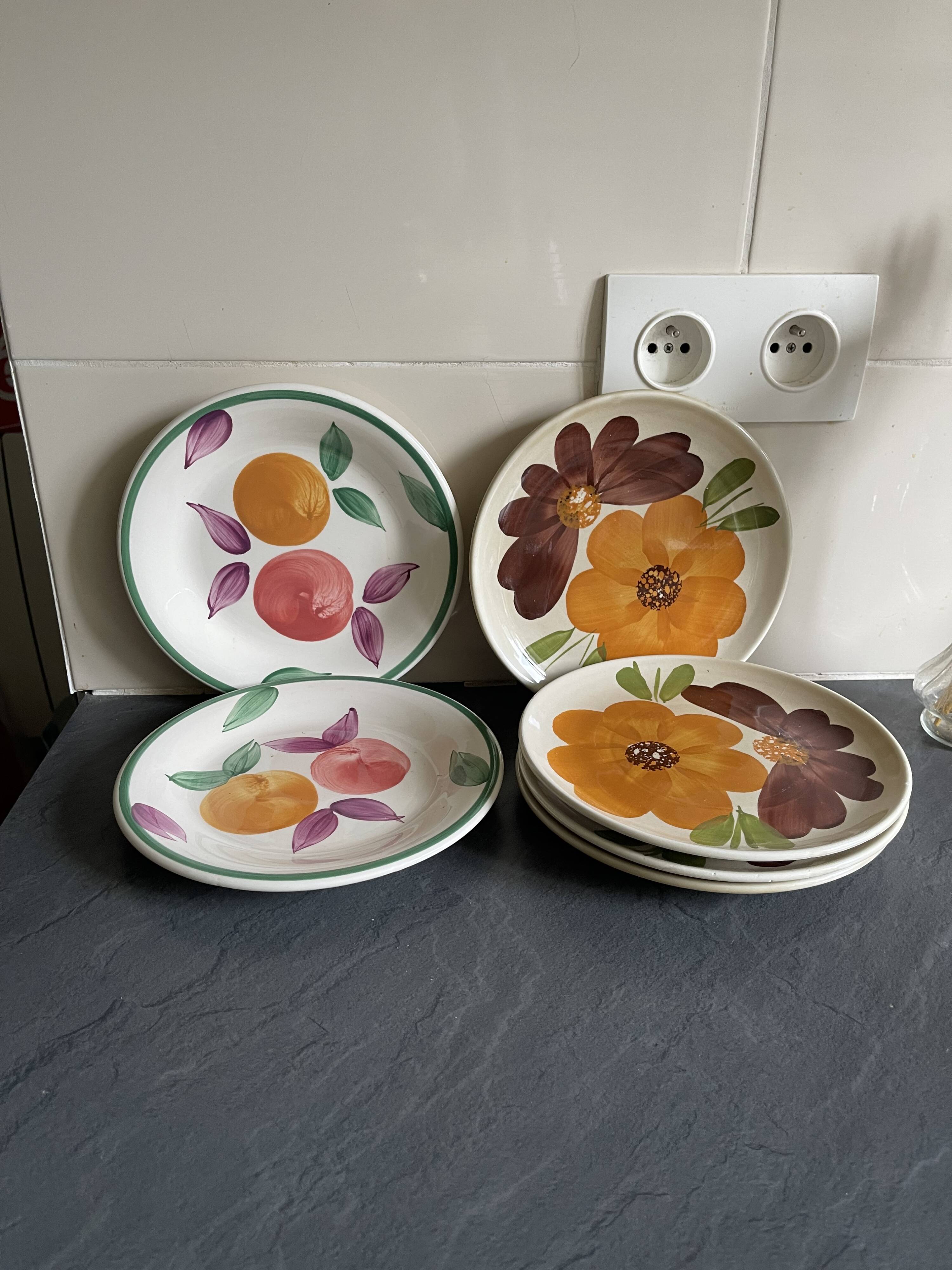 Italian ceramic plates with floral fruit designs.