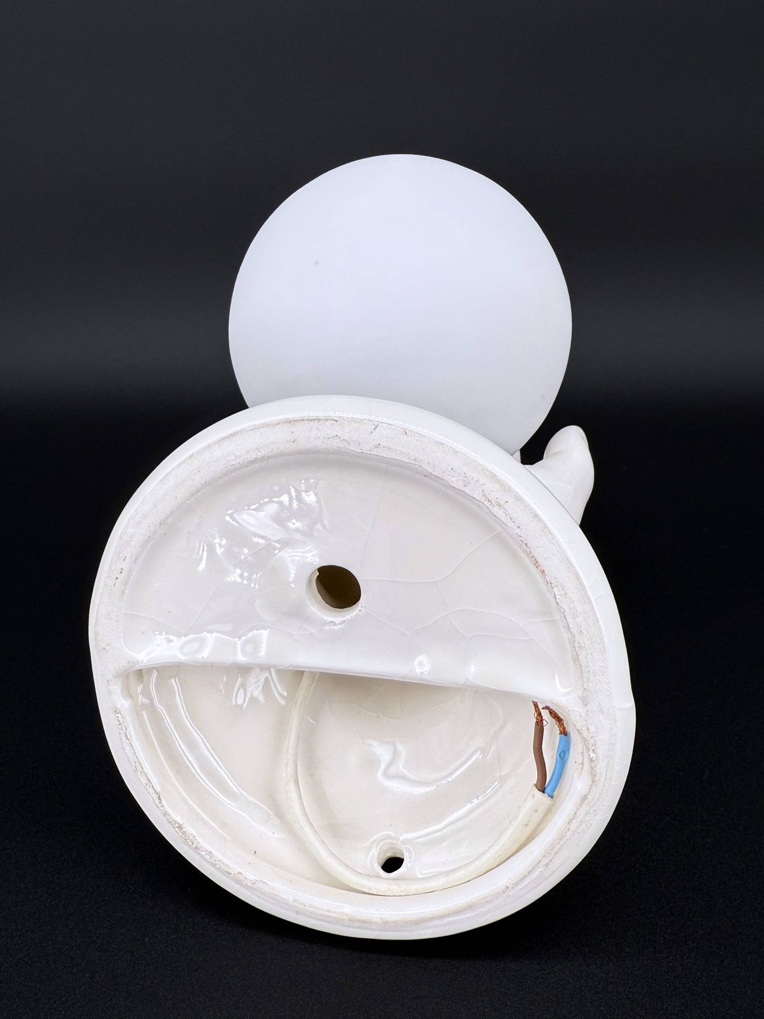 Vintage ceramic wall light - hand holding an opaline globe, 1970s