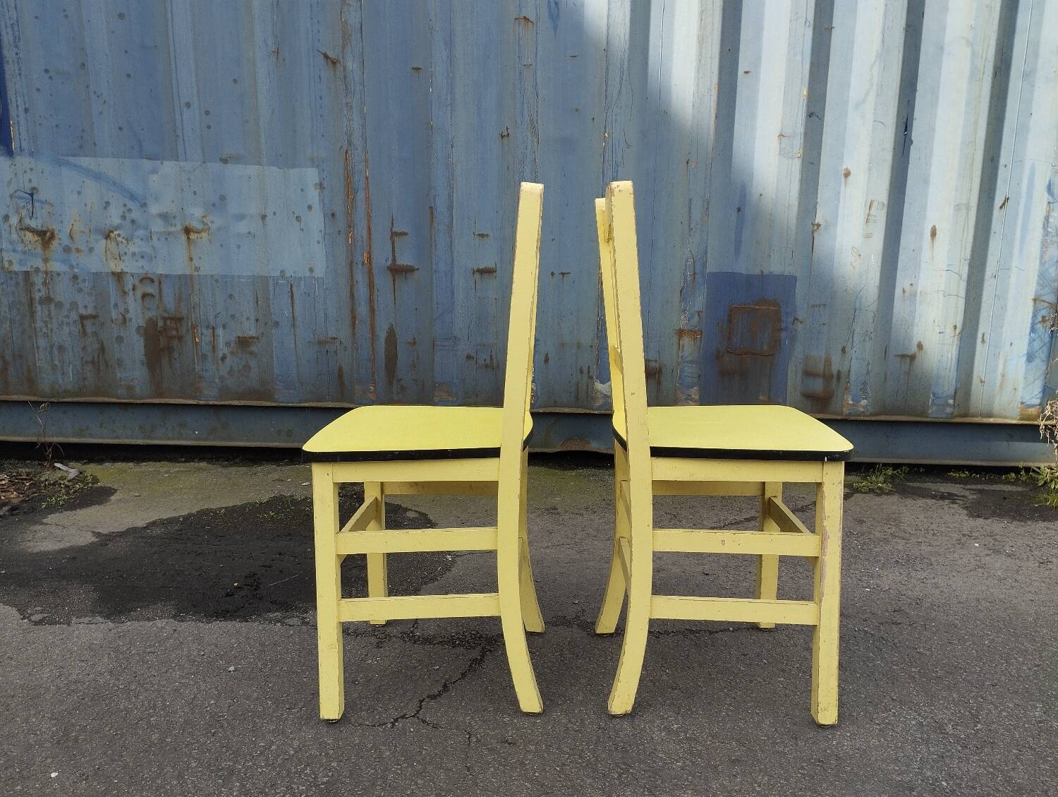 Pair of wooden and yellow formica chairs