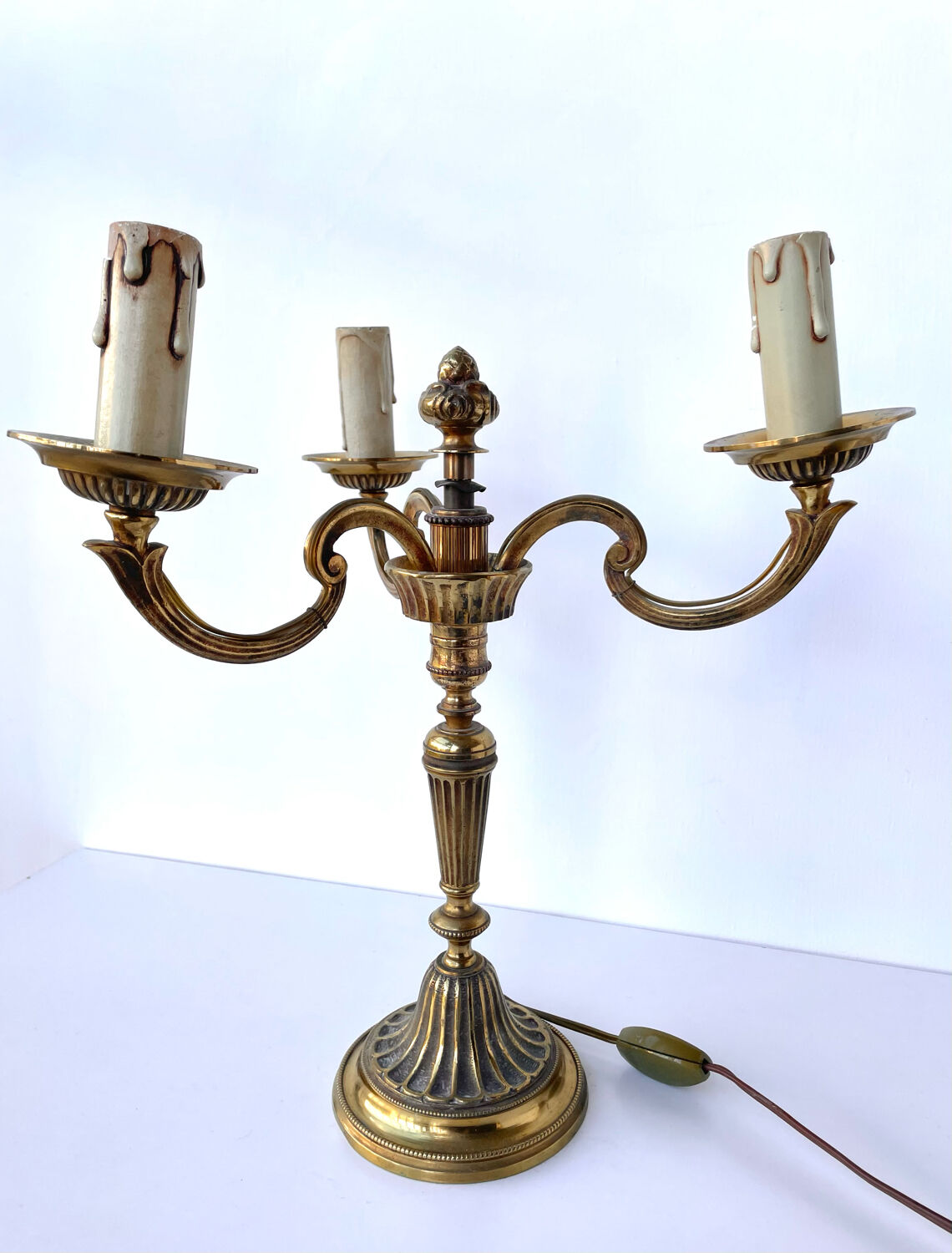 Three-branched golden candlestick