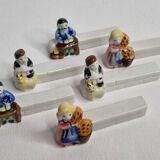 Six Le Merzer porcelain knife holders, 6 cm