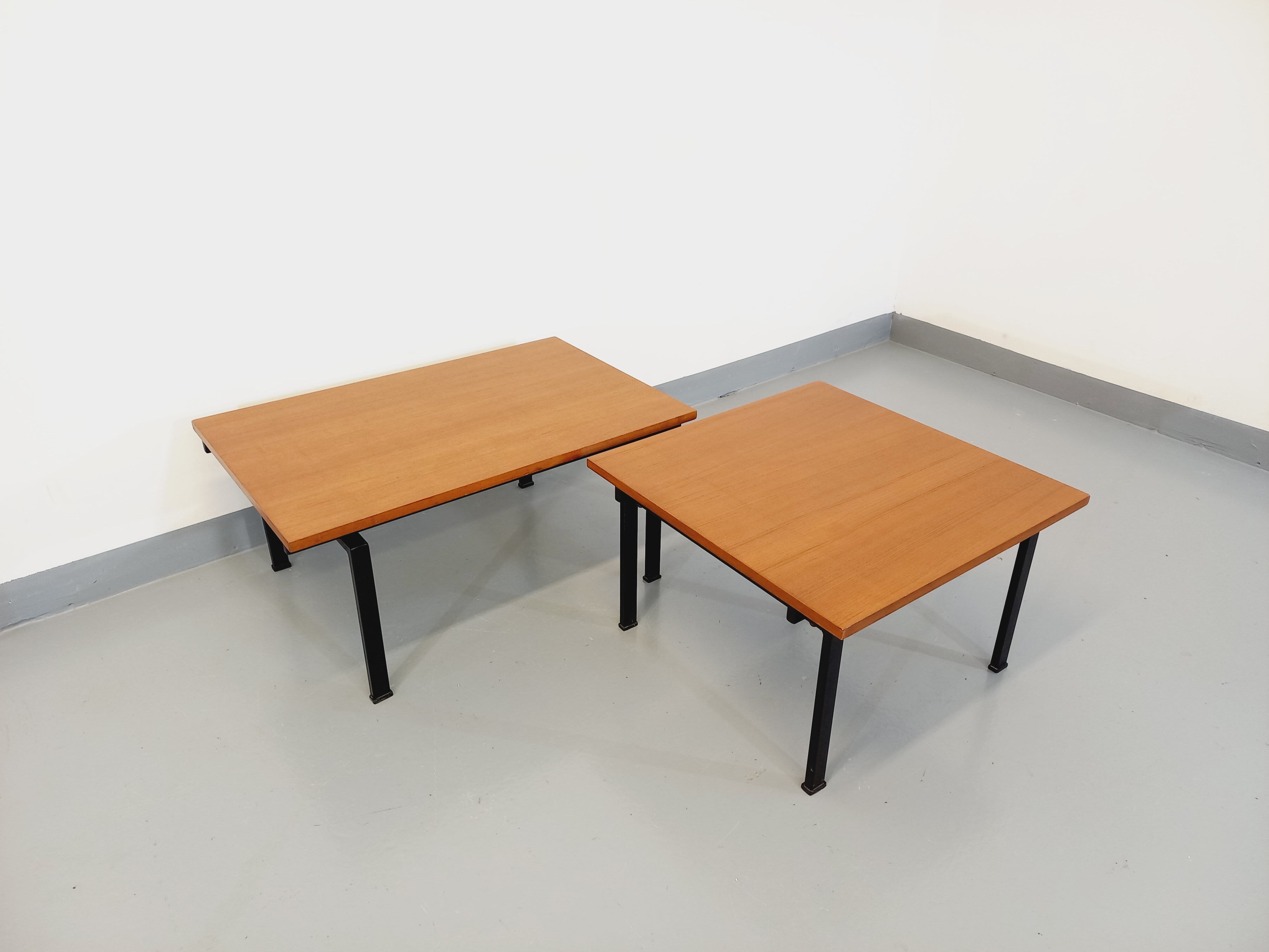 Suite of two vintage modernist Isa coffee tables in teak and black metal from the 60s