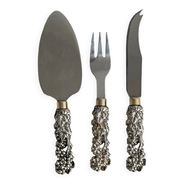Antique shiny metal cheese cutlery