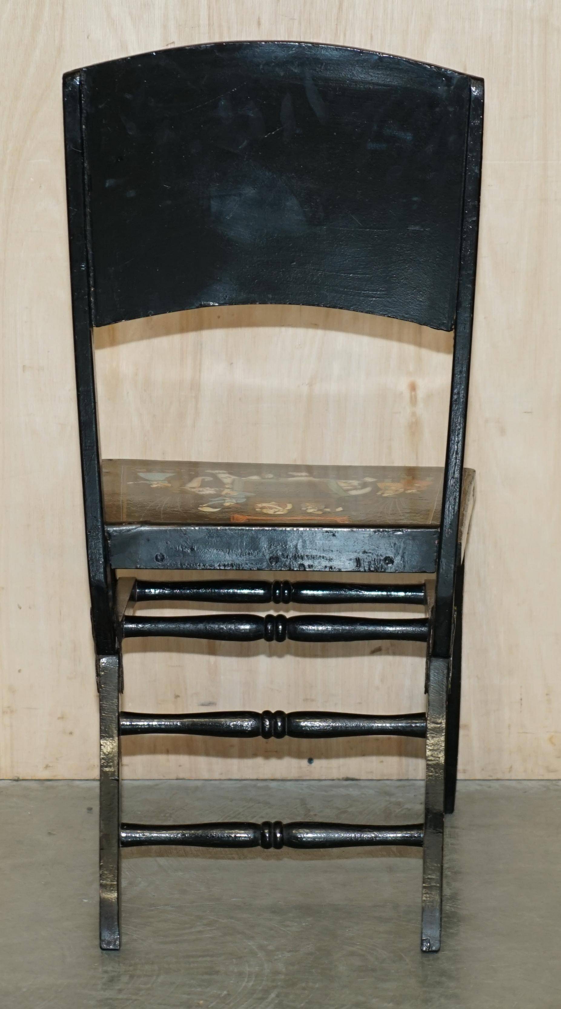 Pair of military folding chairs with Indian decoration.