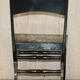 Pair of military folding chairs with Indian decoration.
