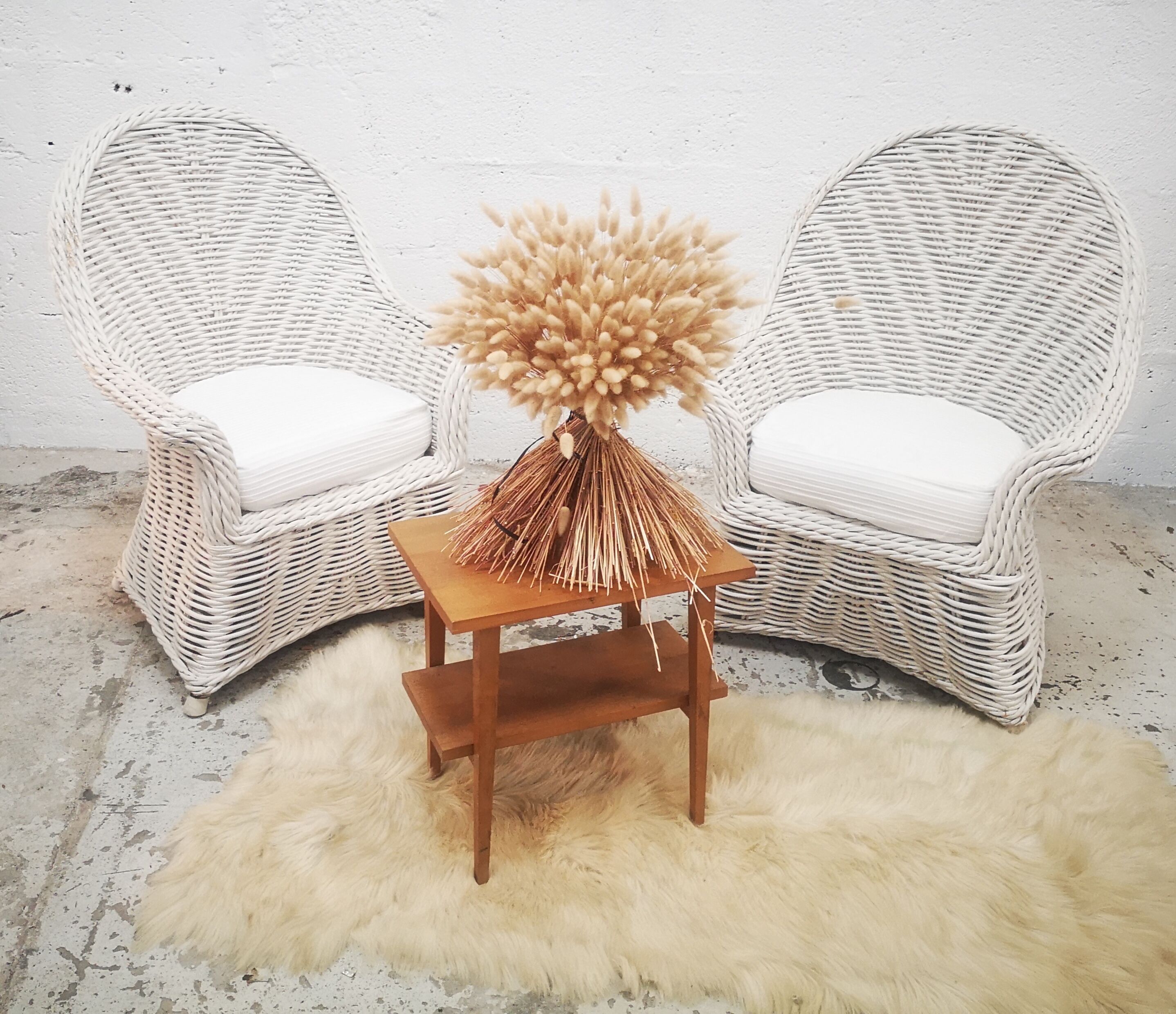 Pair of white rattan armchairs