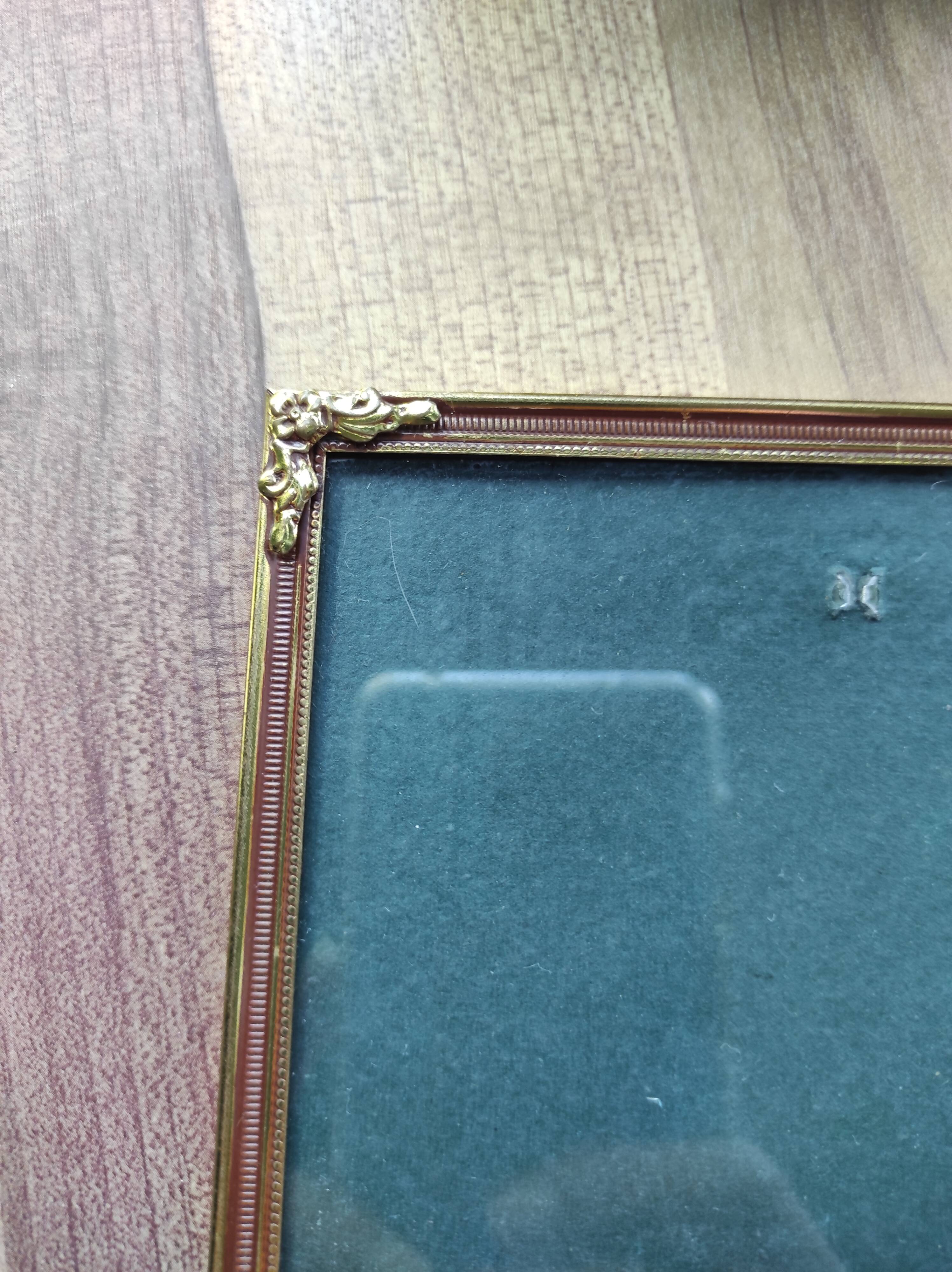 Vintage photo frame in gold and decorated metal