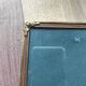 Vintage photo frame in gold and decorated metal