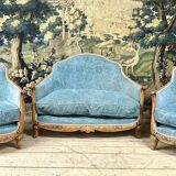Art deco living room around 1920 in carved wood upholstered in blue velvet, a sofa two armchairs