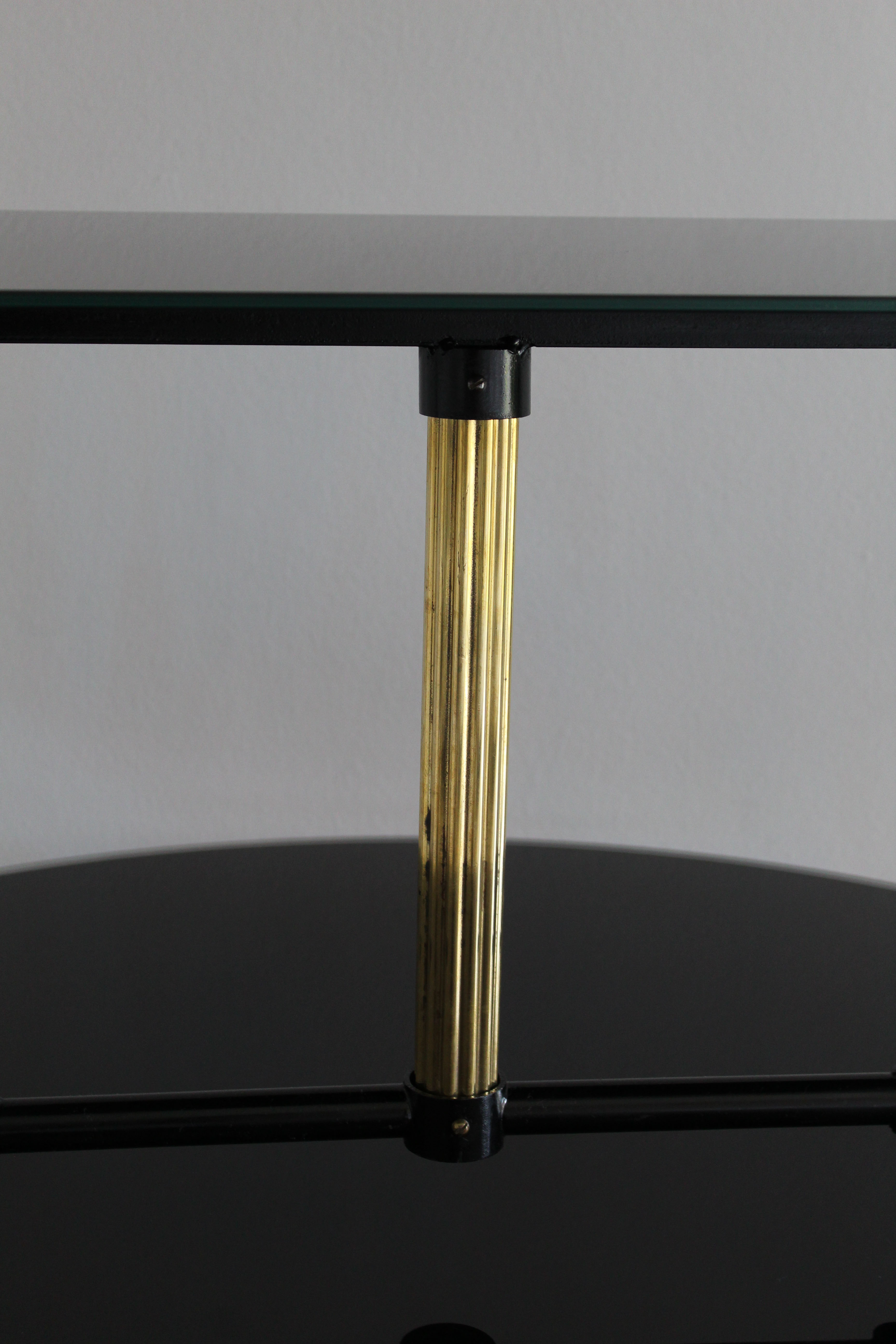 Coffee table in black glass lacquered brass and iron, Italy 50s