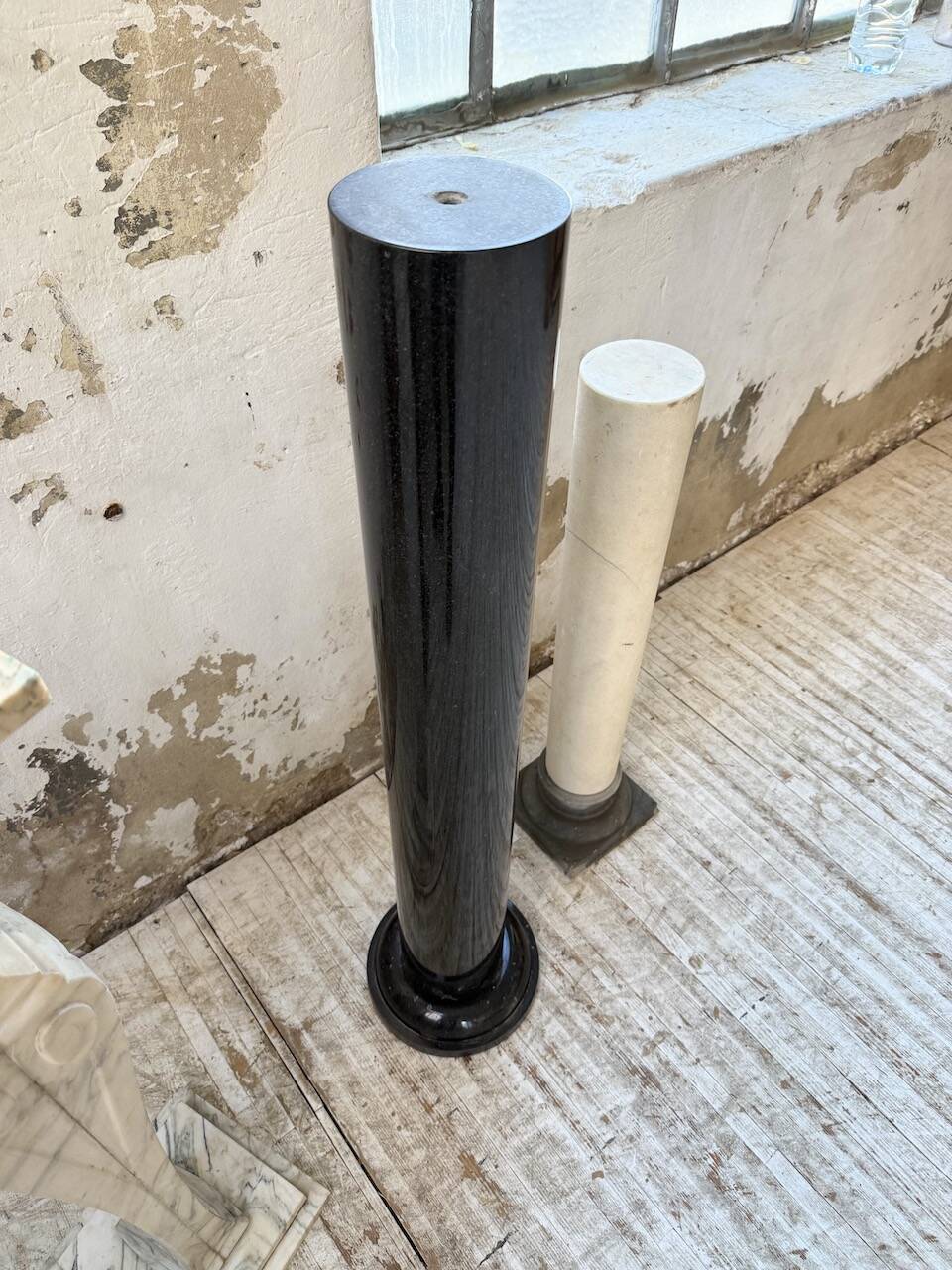 Set of 4 marble columns or pedestals.