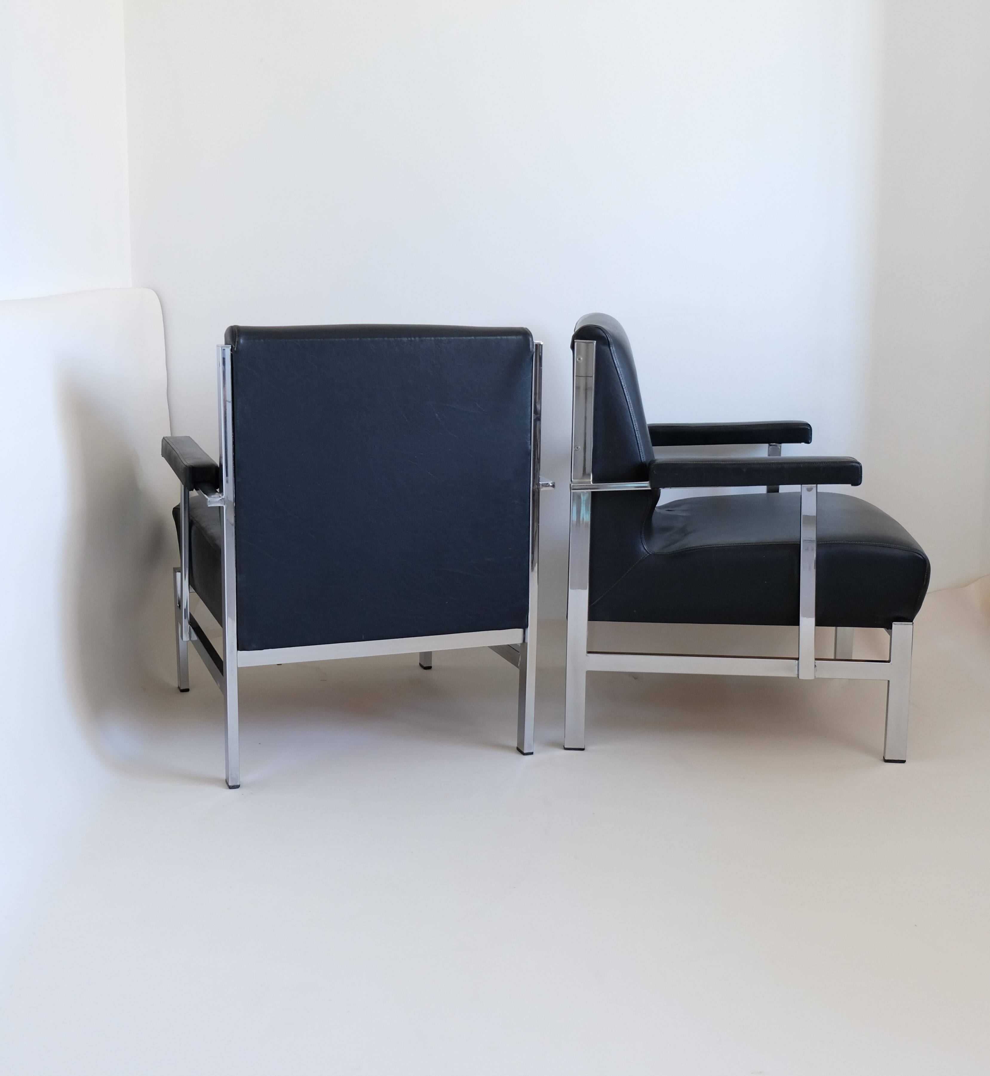 Pair of designer armchairs