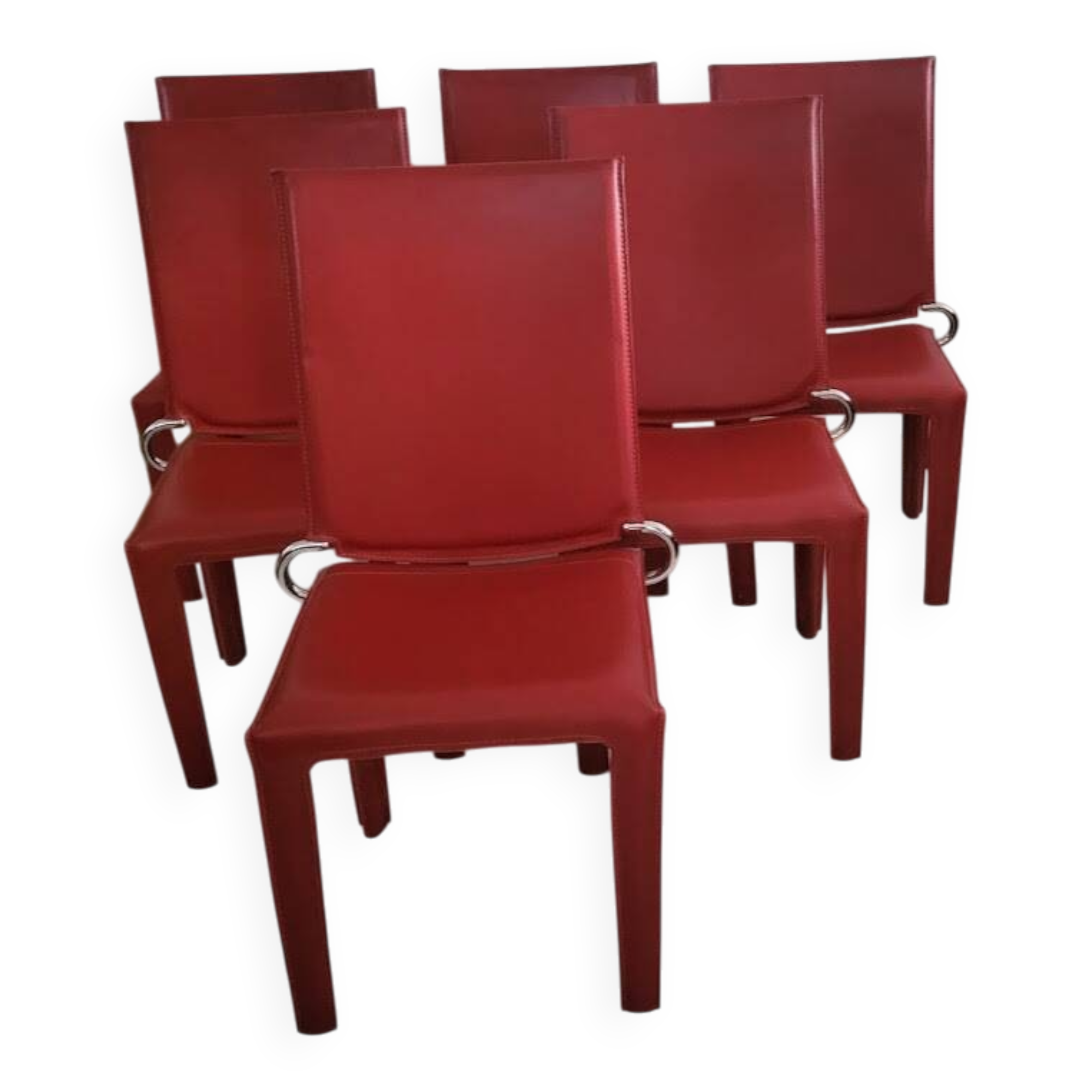 Red leather dining chairs by Arper