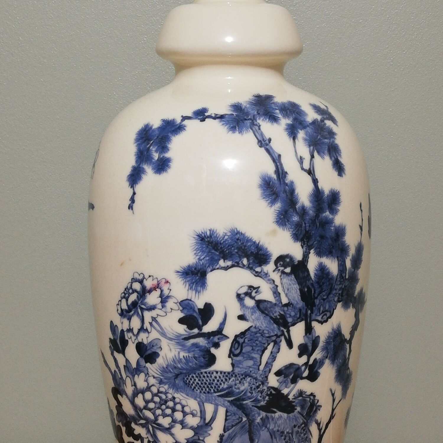 Ceramic lamp with Asian decoration with matching lampshade.