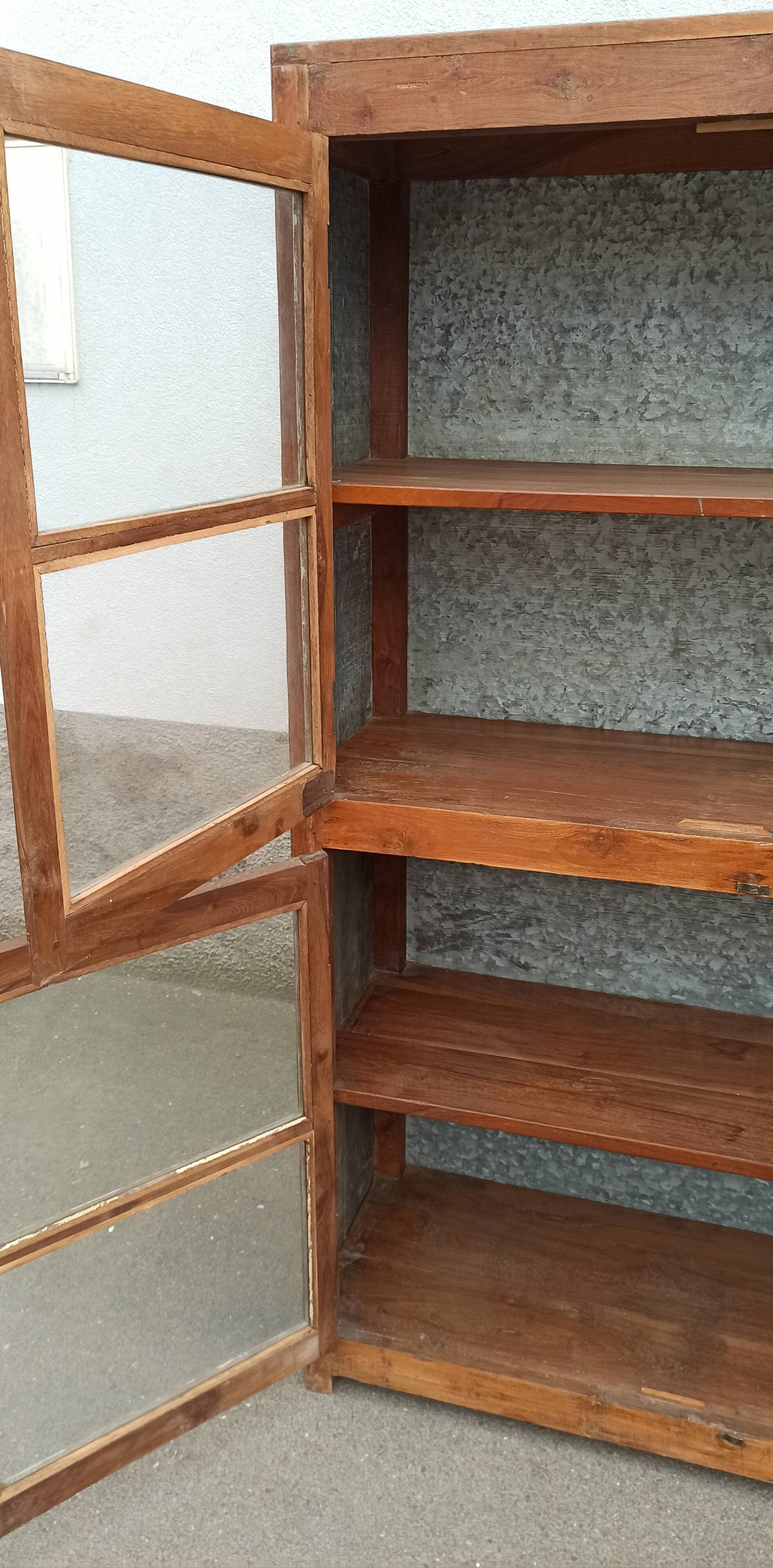 Old glass cabinet in wood and metal