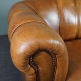 Sheepskin sofa with decorative nails