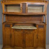 According to Gauthier-Poinsignon: large two-body buffet from the Art Nouveau period in walnut and burl.