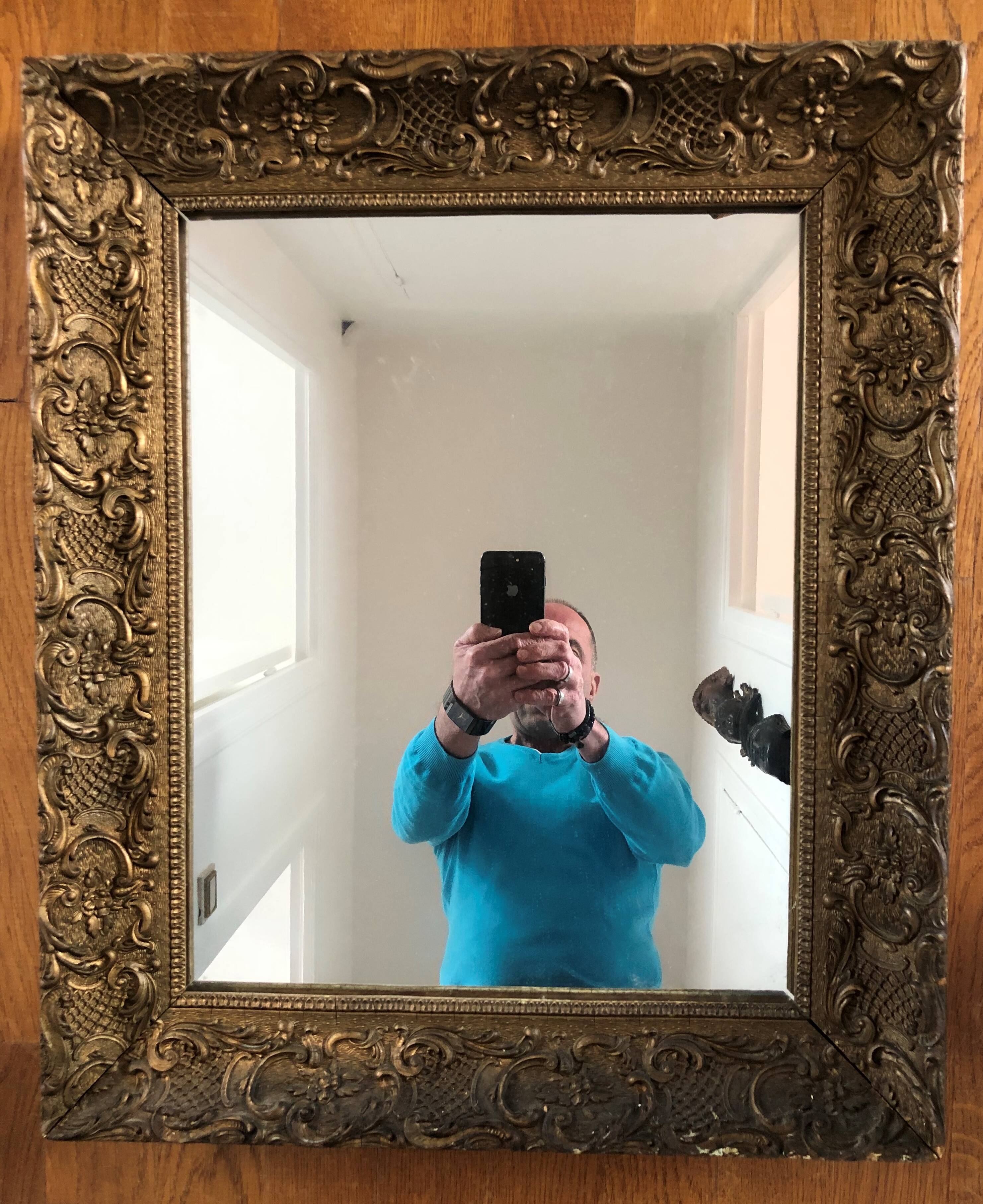 Carved and gilded wooden mirror
