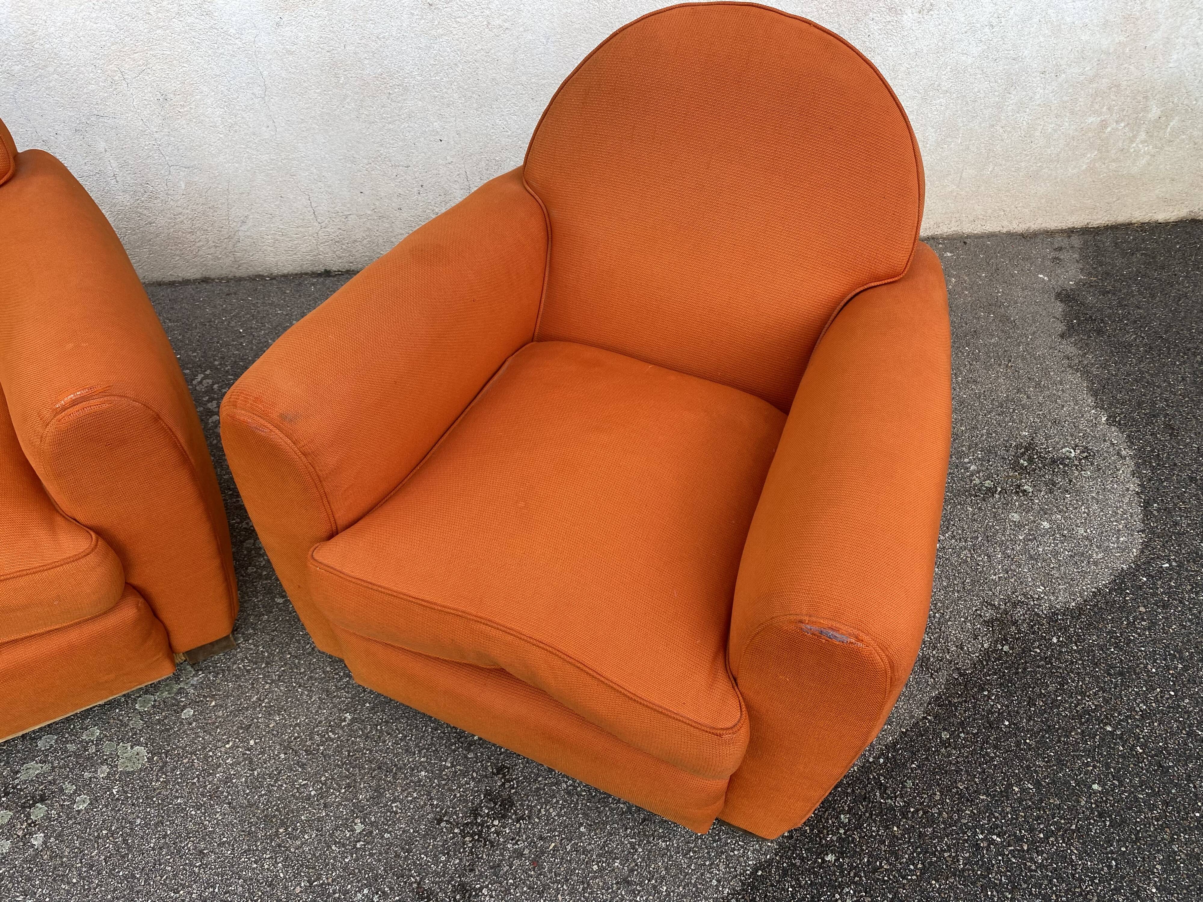Pair of vintage orange club chairs